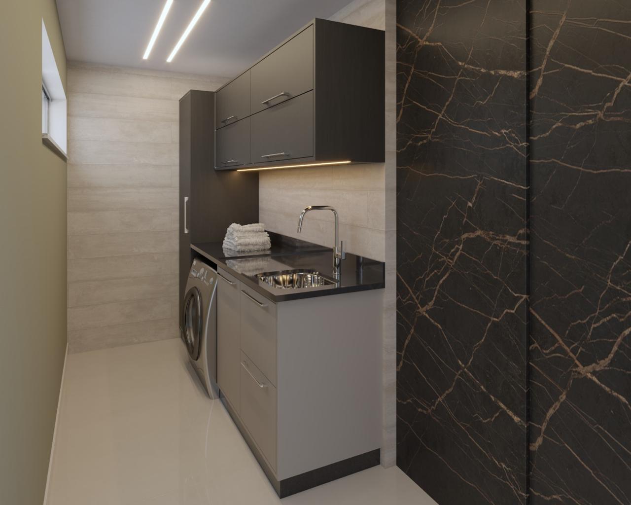 Lavanderia planejada moderna com armários e bancada em granito escuro em Resende